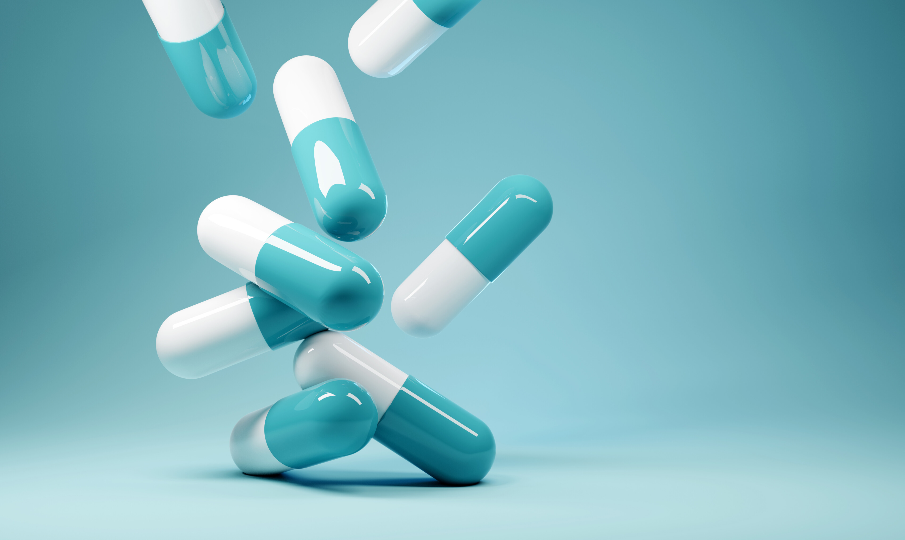 A,group,of,antibiotic,pill,capsules,fallling.,healthcare,and,medical